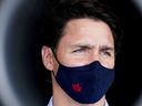Canada's Liberal Prime Minister Justin Trudeau wears a mask before making an announcement inside the Sunwing Airlines hangar during his election campaign tour in Mississauga, Ontario, Canada, on September 3, 2021.  
