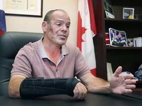 MP Chris Lewis is pictured in his constituency office in Essex on Thursday, September 23, 2021. The reelected member of parliament suffered major injuries when he was thrown from a horse on Election Day.