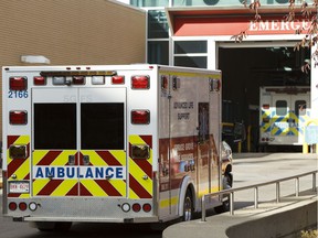 Ambulances are seen outside the Royal Alexandria Hospital in Edmonton, Alta., On Thursday Oct. 16, 2014.