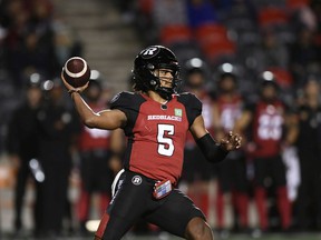 Redblacks quarterback Caleb Evans throws the ball against the Elks during first-half action.