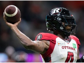Ottawa Redblacks quarterback Dominique Davis passes the BC Lions during the second half of a CFL football game in Vancouver on Saturday, Sept. 11, 2021.