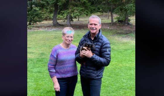 Debbie Robinson and Chris Hadfield posed for a quick photo after they adopted the adorable spaniel Henry into their family.