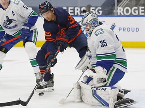 Winger Alex Chiasson, hitting the net against Canucks goalkeeper Thatcher Demko last season, has joined the Canucks in a professional tryout.  He scored nine goals in 45 games last year for the Edmonton Oilers.
