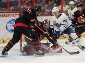 Ottawa Senators goalkeeper Filip Gustavsson (32) saves off Toronto Maple Leafs center Kirill Semyonov (94) in the first period at the Canadian Tire Center.