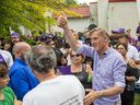 People's Party of Canada leader Maxime Bernier mingles with some of the more than 1,000 supporters who attended a campaign rally at Springbank Gardens in London, Ontario.  on Wednesday, September 15, 2021. 