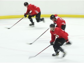 Ottawa Senators participate in skating drills on Thursday.
