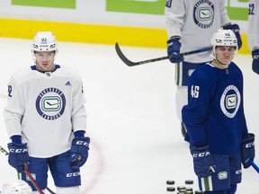 Vasily Podkolzin (left) and Danila Klimovich enjoy their first experience at a National Hockey League training camp, as well as ingratiating themselves with their new teammates.