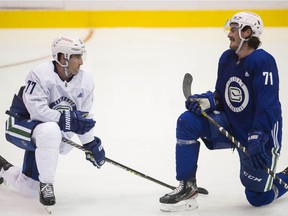 Brad Hunt (# 77) with Zack MacEwen at Canucks Training Camp 2021-22 at the Abbotsford Center on Thursday.