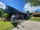 Local leaders, philanthropists and costumed settlers cut the ribbon at the new Heritage and Conservation Center at John R. Park Homestead in Essex on July 2, 2021.