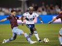 Vancouver Whitecaps FC forward Cristian Dajome (11) controls the ball under pressure from Colorado Rapids defender Keegan Rosenberry (2) in the first half at Dick's Sporting Goods Park.