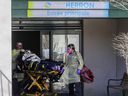 Paramedics remove a resident of CHSLD Herron in Dorval, west of Montreal, on April 8, 2020.