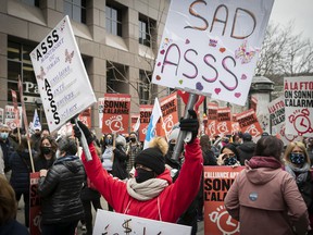 Public health and social services staff gathered outside Prime Minister François Legault's office in March to protest the lack of a contract.