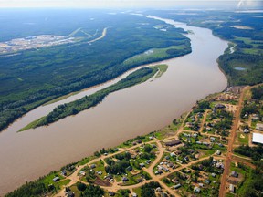 An aerial view of Fort McKay, Alta.  with the Syncrude oil sands operation in the background.  File photo.
