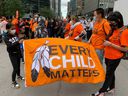 People gather to march in Montreal on Truth and Reconciliation Day, September 30, 2021.