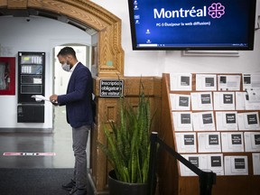 The leader of the Montreal Movement, Balarama Holness, makes a last minute search in the hallways of the city hall.