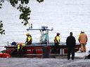 Rescuers search for a missing firefighter in the St. Lawrence River after a rescue operation on October 18, 2021. 