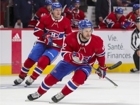 Montreal Canadiens' Jonathan Drouin and rear Christian Dvorak change directions during the first period against the San Jose Sharks in Montreal on October 19, 2021.