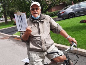 Luc Pigeon, 80, campaigns around Kirkland on his bike.