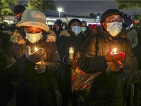 People attend a vigil for Jannai Dopwell-Bailey in Montreal on Friday, Oct. 22, 2021.