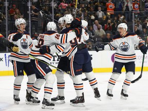 The Edmonton Oilers celebrate a first period power goal by Zach Hyman # 18 against the Vegas Golden Knights during their game at T-Mobile Arena on October 22, 2021 in Las Vegas, Nevada.