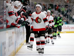 The Senators' Josh Norris celebrates with his teammates after scoring a goal against the Stars in the first period of Friday's game in Dallas.