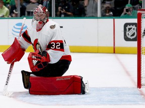 Filip Gustavsson tracks the puck into the corner of the track after making one of his 38 saves for the Senators vs. the Stars on Friday night.