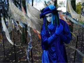 GLASGOW, SCOTLAND - Members of Extinction Rebellion's Blue Rebel Brigade join pilgrimage groups who have walked to Glasgow to raise awareness of the climate crisis on October 30, 2021 in Glasgow, Scotland.