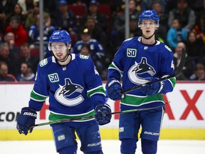 Quinn Hughes and Elias Pettersson signed multi-year contract extensions during training camp.