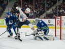 Vancouver Canucks defender Tyler Myers (57) watches as goalkeeper Thatcher Demko (35) makes a save on Edmonton Oilers forward Warren Foegele (37) in the first period at Rogers Arena. 