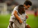 CF Montreal defender Zachary Brault-Guillard (15) celebrates his goal with teammate Joaquín Torres (18) during the first half against DC United at Audi Field in Washington, DC, Sunday, August 8, 2021. 