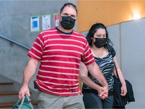 Guy Dion and Marie-Josée Viau are charged with the murders of brothers Vincenzo and Giuseppe Falduto in 2016. The couple entered the Gouin courthouse in Montreal on Thursday, May 27, 2021.