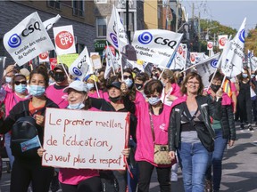 Daycare workers demonstrate on the first day of rotating strikes in Montreal on Tuesday, October 12, 2021.