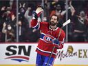 The Canadiens' Mathieu Perreault, who was born and raised in Drummondville, greets fans at the Bell Center after scoring three goals and being named the first star of a 6-1 win over the Detroit Red Wings on Saturday night.