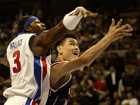 Ben Wallace, left, is seen in action during his game days with the Detroit Pistons protecting Houston's Yao Ming.  Wallace rejoined the team on Friday.