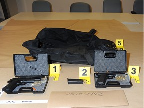 Firearms seized from a warehouse in Laval in September 2019, a month before Marie-Josée Viau and Guy Dion were arrested as suspects in the deaths of Vincenzo and Giuseppe Falduto.