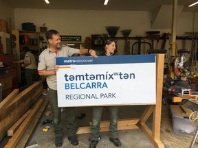 Metro Vancouver staff prepare the new sign for Belcarra Park.  It is now known as t & # 601;  mt & # 601;  me & # 695;  t & # 601;  n