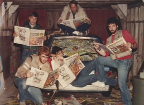 Vancouver province photographers prepare a photo for Peter Hulbert after they played a prank on him by filling his car with trash on April Fool's Day, probably in the mid-1980s. Clockwise from left: Greg Osadchuk, Colin Price, Wayne Leidenfrost, Gerry Kahrmann and Colin Savage.