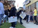 Chrysler workers protest the vaccination mandate in front of the Unifor Building on Turner Road on October 18, 2021.