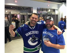 Pemberton's Peter Wortman (left), the Vancouver Canucks season ticket holder for 29 years, and Bill Dix in a 2019 game.