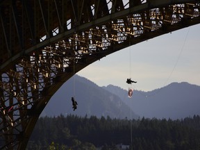 Anti-Trans Mountain protesters plan to rappel from Vancouver's Ironworkers Memorial Bridge as part of an air blockade of tanker traffic Tuesday morning.