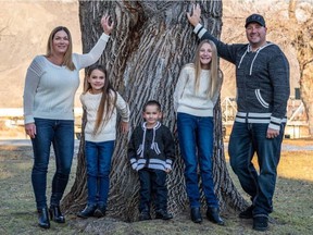 Carla Palkun, far left, and husband Chris Palkun, far right, pose with their children for a photo in January 2020 in Kamloops, BC The Palkuns, who live in the country near Edson, were antivaxxers until they Chris contracted COVID-19 and ended.  in the intensive care unit at Gray Nuns Community Hospital in Edmonton.