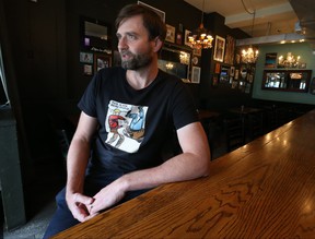 Danforth Ave. bar owner Russell Piffer of The Edmund Burke responds to the announcement made in Queens Park on Friday to open the establishments to full capacity.  QR codes for vaccination are still mandatory on Friday, October 22, 2021.