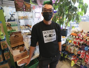 Charles Ng, owner of Bark and Meow pet supplies, on Floor St. West on Christie St. is Toronto's first and only retailer to specialize in vegan dog and cat food and treat options.  He says it has been difficult to acquire everything from food to pet leashes.  Jack Boland / Toronto Sun / Postmedia Network