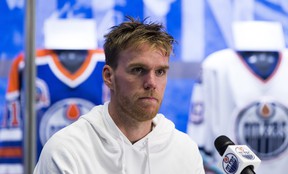 Oilers captain Connor McDavid speaks to reporters after practice Tuesday in Edmonton.