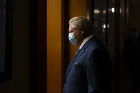 Ontario Prime Minister Doug Ford returns to his office following a press conference at the Queens Park Legislature in Toronto on Friday, October 15, 2021.