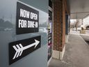 A sign points to a restaurant service for dinner in a plaza at the corner of Steeles Ave. W. and Dufferin St. in Vaughan on Thursday, March 11, 2021.