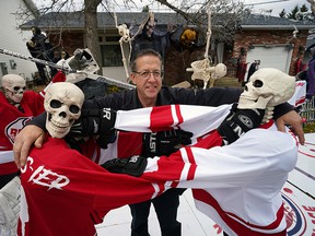 Vince Sinclair spent more than 60 hours putting together a hockey-themed Halloween display about the “Battle of Alberta” in the front yard of his home on Addison Crescent in St. Albert.  (PHOTO BY LARRY WONG / POSTMEDIA)