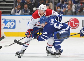 Jake Evans of the Montreal Canadiens fights David Kampf of the Maple Leafs during Wednesday's game. CLAUS ANDERSEN / GETTY IMAGES