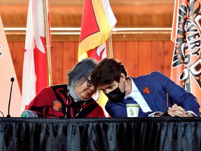 Prime Minister Justin Trudeau and National Head of the Assembly of First Nations RoseAnne Archibald at the Tk'emlups PowWow Arbor in Kamloops, BC on October 18, 2021.