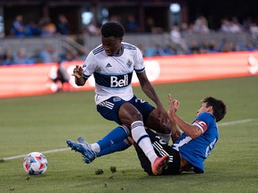 Vancouver Whitecaps defender Javain Brown collides with San Jose Earthquakes midfielder Shea Salinas during the first half at PayPal Park.